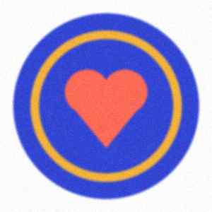 A blurry, noisy photo of a round badge with a heart